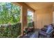 View of the balcony, showcasing the seating and greenery at 3845 Wiggins Bay St # 202, Las Vegas, NV 89129