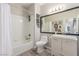 Well-lit bathroom featuring a shower and tub combination and a vanity at 3845 Wiggins Bay St # 202, Las Vegas, NV 89129