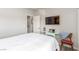 Neutral bedroom with bed, closet and decorative table and a television at 3845 Wiggins Bay St # 202, Las Vegas, NV 89129