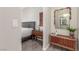 Stylish bedroom featuring neutral colors, wood floors, and decorative furniture at 3845 Wiggins Bay St # 202, Las Vegas, NV 89129