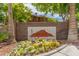 Entrance to the community featuring a sign with a landscaped area at 3845 Wiggins Bay St # 202, Las Vegas, NV 89129