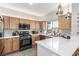 Well-equipped kitchen with stainless steel appliances, quartz countertops, and ample cabinet space at 3845 Wiggins Bay St # 202, Las Vegas, NV 89129