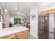 Bright and open kitchen with stainless steel appliances, island seating and views of the living area at 3845 Wiggins Bay St # 202, Las Vegas, NV 89129