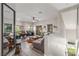 Bright, open-concept living room featuring stylish decor, comfortable seating, and abundant natural light at 3845 Wiggins Bay St # 202, Las Vegas, NV 89129