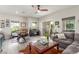Bright living room with a comfortable couch and sleek floors, perfect for modern living and entertaining at 3845 Wiggins Bay St # 202, Las Vegas, NV 89129