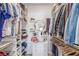 Organized walk-in closet features shelving, drawers and hanging rods for optimal storage at 3845 Wiggins Bay St # 202, Las Vegas, NV 89129