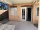 Covered back patio featuring ample sunlight, complemented by clean lines and offering views into the home's interior at 3882 Genoa Dr, Las Vegas, NV 89141