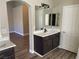 Dual sink bathroom featuring a vanity, sleek fixtures, and modern accents at 3882 Genoa Dr, Las Vegas, NV 89141