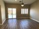 Bedroom with tile floors, bright windows, sliding glass door to backyard pool at 3882 Genoa Dr, Las Vegas, NV 89141