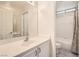 Well-lit bathroom featuring a large mirror and tub-shower combo at 427 Rhythm St, Henderson, NV 89074
