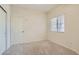 Neutral bedroom featuring a window for natural light and neutral carpet at 427 Rhythm St, Henderson, NV 89074