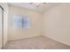 Bedroom featuring neutral carpet, a window with blinds, and a closet with sliding doors at 427 Rhythm St, Henderson, NV 89074
