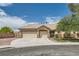 Charming single-story home featuring a stucco exterior, well-maintained landscaping, and a spacious three-car garage at 427 Rhythm St, Henderson, NV 89074