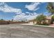 View of the home featuring a stucco exterior, desert landscaping, concrete driveway, and two-car garage at 427 Rhythm St, Henderson, NV 89074