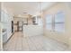 Spacious kitchen featuring a breakfast bar, modern appliances, and abundant natural light, creating a welcoming atmosphere at 427 Rhythm St, Henderson, NV 89074