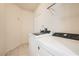 Laundry room with a new, front-loading washer and dryer at 427 Rhythm St, Henderson, NV 89074