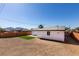 Spacious backyard enclosed by a fence, featuring a small patch of turf at 4360 El Tovar Rd, Las Vegas, NV 89115