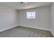 Bedroom with window, gray carpet and white walls at 4360 El Tovar Rd, Las Vegas, NV 89115