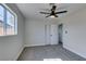 Bright bedroom features neutral walls, carpet, ceiling fan and closet at 4360 El Tovar Rd, Las Vegas, NV 89115