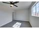 Bedroom with window, gray carpet and white walls at 4360 El Tovar Rd, Las Vegas, NV 89115