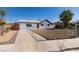 Inviting front yard and driveway to a charming single-story home in a sunny locale at 4360 El Tovar Rd, Las Vegas, NV 89115