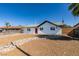 Lovely single-story home with desert landscaping, a bright red door, and a fenced yard at 4360 El Tovar Rd, Las Vegas, NV 89115
