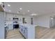 Bright kitchen with an island, stainless steel appliances, and modern cabinets at 4360 El Tovar Rd, Las Vegas, NV 89115