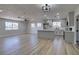 An open floorplan with a remodeled kitchen, light wood flooring, and lots of natural light at 4360 El Tovar Rd, Las Vegas, NV 89115