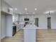 Bright open kitchen boasts an island with quartz counters, and modern stainless steel appliances at 4360 El Tovar Rd, Las Vegas, NV 89115