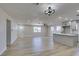 Open living space with light wood flooring, neutral walls, and a remodeled kitchen at 4360 El Tovar Rd, Las Vegas, NV 89115
