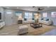 Bright living room with neutral furniture, blue accent pillows, and stylish decor at 4360 El Tovar Rd, Las Vegas, NV 89115