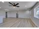 Open floor plan with wood flooring, a ceiling fan, and recessed lighting at 4360 El Tovar Rd, Las Vegas, NV 89115