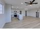 Living room with kitchen featuring an island and modern appliances at 4360 El Tovar Rd, Las Vegas, NV 89115