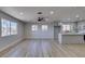 Open layout with wood flooring, a ceiling fan, and natural light at 4360 El Tovar Rd, Las Vegas, NV 89115