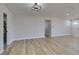 The living room features light wood flooring, fresh paint, recessed lighting and modern lighting fixture at 4360 El Tovar Rd, Las Vegas, NV 89115