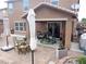 Inviting backyard patio with tiled area, outdoor seating, and covered porch at 4361 Duck Harbor Ave, North Las Vegas, NV 89031