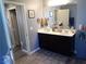 Modern bathroom with double vanity, large mirror, and updated fixtures at 4361 Duck Harbor Ave, North Las Vegas, NV 89031