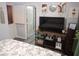 Comfortable bedroom features a TV, cozy decor, and modern touches for relaxation at 4361 Duck Harbor Ave, North Las Vegas, NV 89031