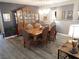 Formal dining room with ornate wood furniture, elegant chandelier, and decorative accents at 4361 Duck Harbor Ave, North Las Vegas, NV 89031