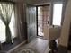 Inviting entryway featuring a decorative front door, stylish rug, and wood-look flooring at 4361 Duck Harbor Ave, North Las Vegas, NV 89031