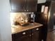 Gourmet coffee bar with granite countertops and stylish black cabinetry at 4361 Duck Harbor Ave, North Las Vegas, NV 89031