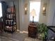 Cozy living room corner with ladder bookshelf, stylish decor, and a bright window at 4361 Duck Harbor Ave, North Las Vegas, NV 89031