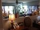 Open-concept living room with warm lighting and a blend of modern and classic decor elements at 4361 Duck Harbor Ave, North Las Vegas, NV 89031