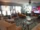 Spacious living room with fireplace, comfortable seating, and plenty of natural light at 4361 Duck Harbor Ave, North Las Vegas, NV 89031