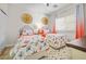 Charming bedroom with twin beds, decorative wall art, and natural light from the window at 4465 Shimmering Skies St # 1177, North Las Vegas, NV 89031