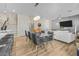 Elegant dining space with modern lighting fixtures and contemporary decor at 4465 Shimmering Skies St # 1177, North Las Vegas, NV 89031