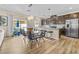 Open kitchen and dining area with stainless steel appliances and ample counter space at 4465 Shimmering Skies St # 1177, North Las Vegas, NV 89031