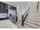 Modern kitchen featuring stainless steel appliances, granite countertops, and dark cabinets at 4465 Shimmering Skies St # 1177, North Las Vegas, NV 89031