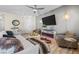 Cozy living room with a stylish fireplace and designer furniture at 4465 Shimmering Skies St # 1177, North Las Vegas, NV 89031