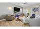 Comfortable living area with neutral tones, ceiling fan, and decorative pillows at 4465 Shimmering Skies St # 1177, North Las Vegas, NV 89031